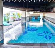 Swimming Pool 5 Comfy and Clean Studio Room at Tamansari La Grande Apartment By Travelio