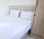 Bedroom 2 Homey and Modern 2BR at Puncak Kertajaya Apartment By Travelio