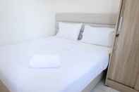Bedroom Homey and Modern 2BR at Puncak Kertajaya Apartment By Travelio