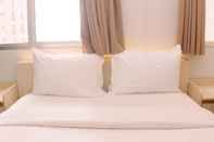 Bedroom Pleasurable 2BR at Apartment Transpark Juanda By Travelio
