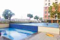 Swimming Pool Cozy Studio Apartment at Lagoon Bekasi Town Square By Travelio