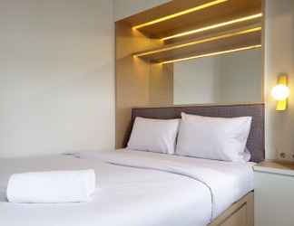 Bedroom 2 Cozy and Minimalist 2BR at La Hub City Apartment By Travelio
