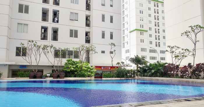 Swimming Pool Strategic and Comfy 2BR at Bassura City Apartment By Travelio
