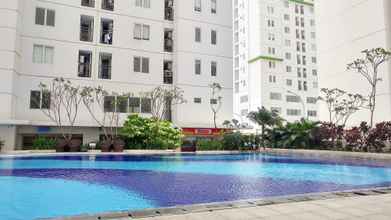 Kolam Renang 4 Strategic and Comfy 2BR at Bassura City Apartment By Travelio