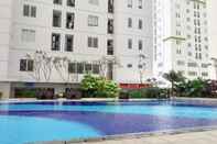 Swimming Pool Strategic and Comfy 2BR at Bassura City Apartment By Travelio