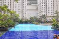 Swimming Pool Comfortable and Fully Furnished Design 2BR Green Bay Pluit Apartment By Travelio