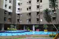 Swimming Pool Cozy Stay and Modern 2BR Apartment at Gateway Ahmad Yani Cicadas By Travelio