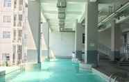 Swimming Pool 5 Homey Studio Room at Harvard Jatinangor Apartment By Travelio