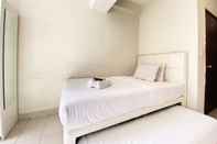 Kamar Tidur Homey Studio Room at Harvard Jatinangor Apartment By Travelio