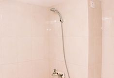 In-room Bathroom 4 Modern and Cozy Studio at Springlake Summarecon Bekasi Apartment By Travelio