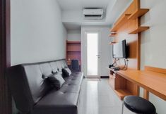 Common Space 2 Comfort and Nice 1BR Apartment at Scientia Residence By Travelio