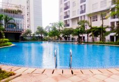 Swimming Pool 5 Comfort and Nice 1BR Apartment at Scientia Residence By Travelio