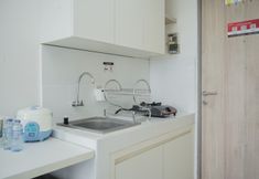 Common Space 3 Warm and Comfort Studio Room at Akasa Pure Living BSD Apartment By Travelio