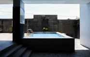 Swimming Pool 5 Relaxing Studio at Puri Mas Apartment By Travelio