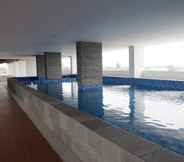 Swimming Pool 6 Comfort and Cozy Studio Room at Poris 88 Apartment By Travelio