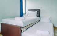 Bedroom 2 Spacious 3BR Apartment at Kondominium Golf Karawaci By Travelio