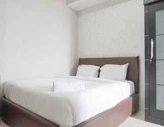 Bedroom 2 Tidy and Homey 2BR Apartment at Seasons City Latumenten By Travelio