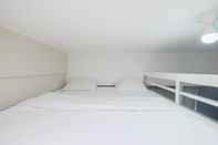 Bedroom Restful and Warm Studio at Springlake Summarecon Apartment By Travelio