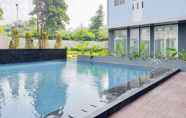 Swimming Pool 6 Warm and Cozy Studio at Urbantown Serpong Apartment By Travelio