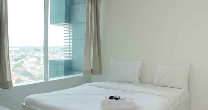 Kamar Tidur Cozy and Warm Studio at Grand Kamala Lagoon Apartment By Travelio