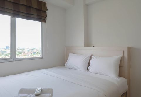 Bedroom 2BR Apartment with Cozy Style at Bassura City By Travelio