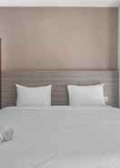 BEDROOM Modern Minimalist Studio Room Apartment at Taman Melati By Travelio