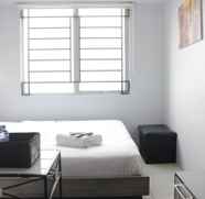 Bedroom 2 Relaxing and Bright Studio at The Edge Cimahi Apartment By Travelio
