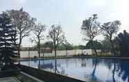Swimming Pool 7 Homey 2BR Furnished at Apartment The Edge Bandung By Travelio