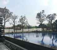 Swimming Pool 7 Homey 2BR Furnished at Apartment The Edge Bandung By Travelio