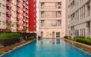 Swimming Pool 6 Cozy Stay Studio at Taman Melati Margonda Apartment By Travelio