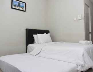 Bedroom 2 Tidy and Homey Studio Taman Melati Margonda Apartment near Campus By Travelio