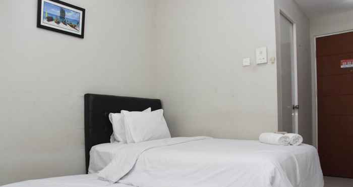 Bedroom Tidy and Homey Studio Taman Melati Margonda Apartment near Campus By Travelio