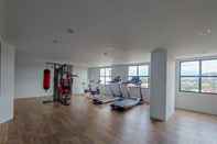 Fitness Center Fully Furnished 1BR at The Alton Apartment By Travelio