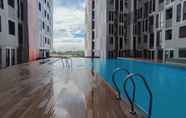 Kolam Renang 6 Fully Furnished 1BR at The Alton Apartment By Travelio