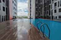 Swimming Pool Fully Furnished 1BR at The Alton Apartment By Travelio