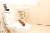 In-room Bathroom Well Design and Comfort 2BR with Working Room at Meikarta Apartment By Travelio