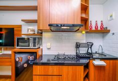 Common Space 4 Minimalist Studio Room near Shopping Center at Transpark Cibubur Apartment By Travelio