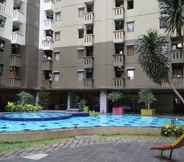 Swimming Pool 6 Homey 2BR Apartment at Gateway Ahmad Yani Cicadas By Travelio