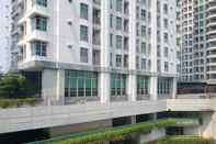 Exterior Cozy Living and Nice 2BR Apartment at Green Bay Pluit By Travelio