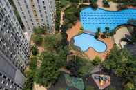 Kolam Renang Homey and Tranquil Designed 2BR at Springlake Summarecon Bekasi Apartment By Travelio