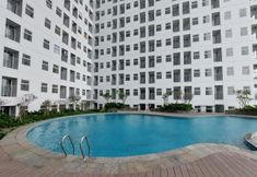 Swimming Pool 7 Homey and Fully Furnished Studio Serpong Garden Apartment By Travelio