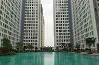 Swimming Pool Serene and Well Designed 2BR Apartment at M-Town Residence By Travelio