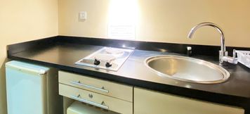 Common Space 3 1BR Cozy Apartment at Braga City Walk By Travelio