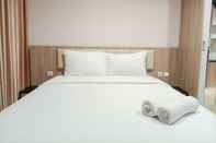 Bedroom Comfortable and Elegant Studio Patraland Amarta Apartment By Travelio