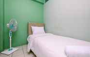 Bedroom 2 Cozy Style and Minimalist 2BR at Green Pramuka City Apartment By Travelio