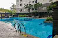 Swimming Pool Cozy Style and Minimalist 2BR at Green Pramuka City Apartment By Travelio