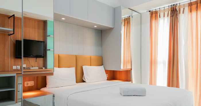 Bedroom Cozy Stay and Warm Studio at Casa de Parco Apartment By Travelio