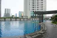 Swimming Pool Elegant and Nice 1BR at The Wave Kuningan Apartment By Travelio