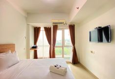 Common Space 2 Cozy and Warm Studio at Taman Melati Jatinangor Apartment By Travelio