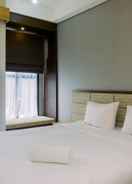 BEDROOM Warm and Minimalist Studio at Transpark Bintaro Apartment By Travelio